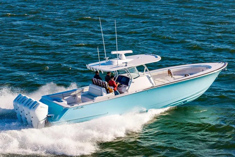 Slide: The Image of 2025 Valhalla Boatworks V-41 cruising on open water, showcasing sleek design and powerful engines. - 2