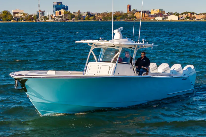 Slide: The Image of 2025 Valhalla Boatworks V-41 cruising on blue waters near a city skyline. - 28