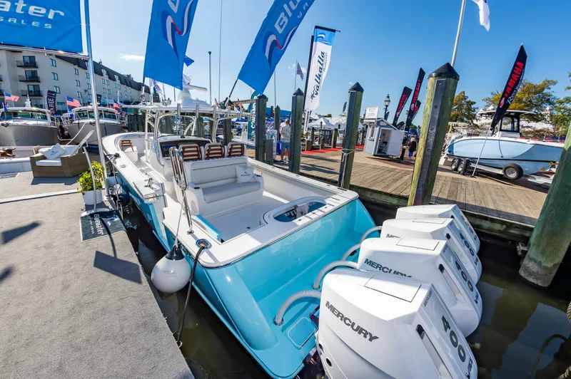 Slide: The Image of 2025 Valhalla Boatworks V-41 with triple Mercury engines docked at a marina. - 4