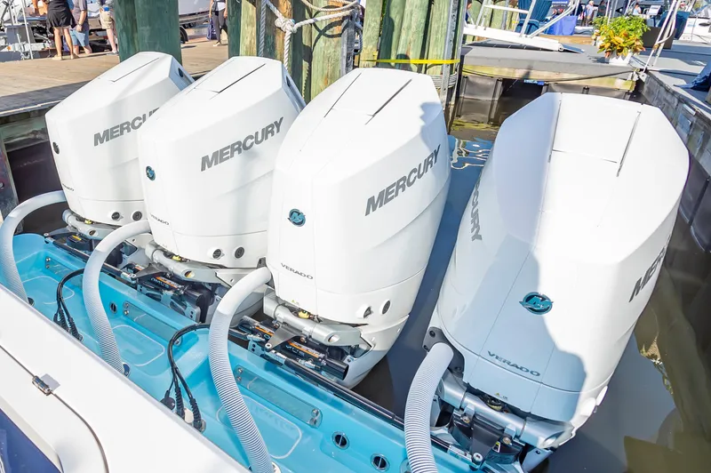 Slide: The Image of 2025 Valhalla V-41 boat with four Mercury outboard engines at a dock. - 5