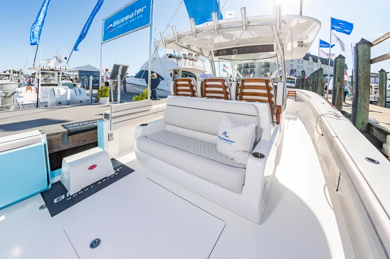 Slide: The Image of 2025 Valhalla Boatworks V-41 luxury seating area at marina. - 8