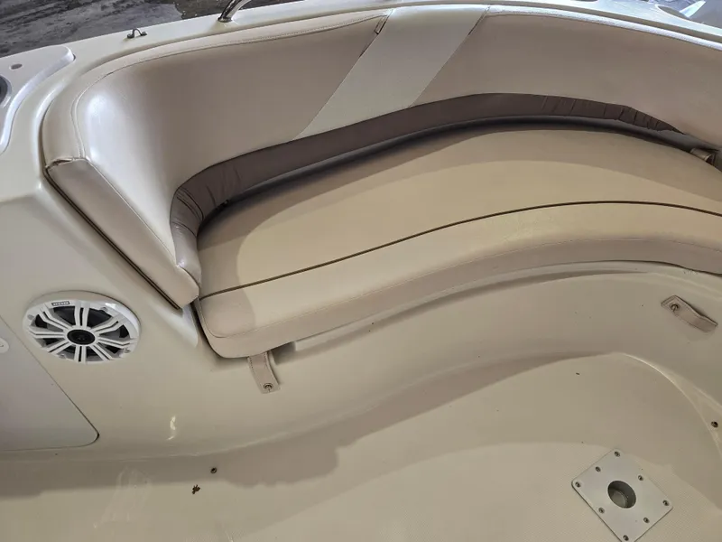 Slide: The Image of 1999 Regal Destiny 200 boat interior with beige seating and speaker. - 10