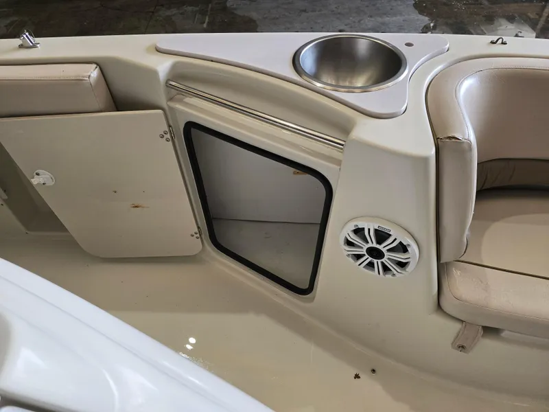 Slide: The Image of Interior of a 1999 Regal Destiny 200 boat with storage compartment and sink. - 11