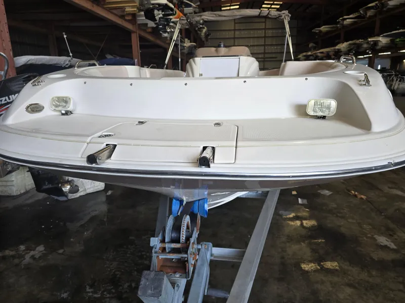 Slide: The Image of 1999 Regal Destiny 200 boat in storage, rear view showing deck and lights. - 12