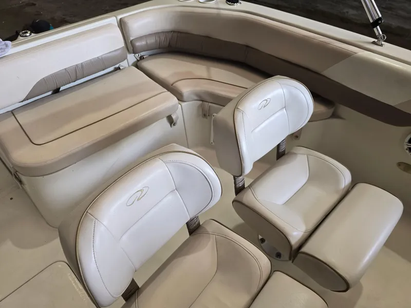 Slide: The Image of 1999 Regal Destiny 200 boat interior with beige and white seating. - 14
