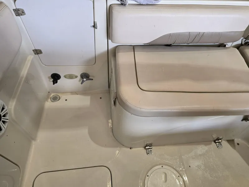 Slide: The Image of Interior of a 1999 Regal Destiny 200 boat showing seating and storage compartments. - 15