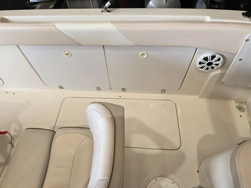 Slide: The Image of 1999 Regal Destiny 200 boat interior with seating and storage compartments. - 16