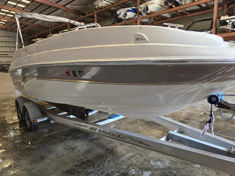 Slide: The Image of 1999 Regal Destiny 200 boat on EZ Loader trailer in storage facility. - 3