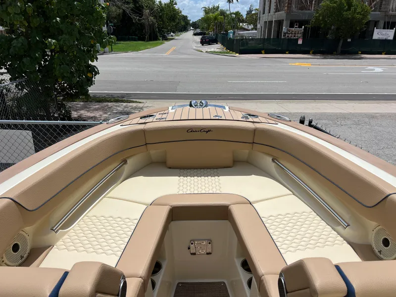 Slide: The Image of 2024 Chris-Craft Launch 25 GT boat interior with beige and cream seating. - 13