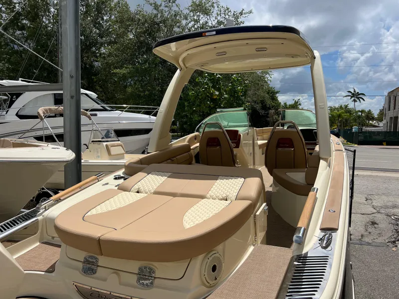 Slide: The Image of 2024 Chris-Craft Launch 25 GT luxury boat with tan upholstery and sleek design. - 4