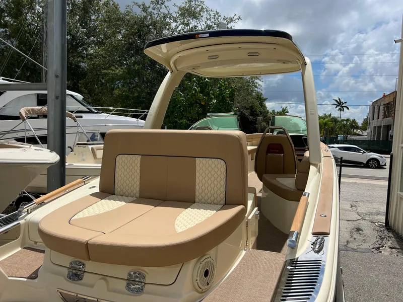 Slide: The Image of 2024 Chris-Craft Launch 25 GT luxury boat with tan upholstery and sleek design. - 5