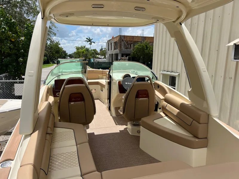 Slide: The Image of 2024 Chris-Craft Launch 25 GT boat interior with beige seating and modern design. - 7