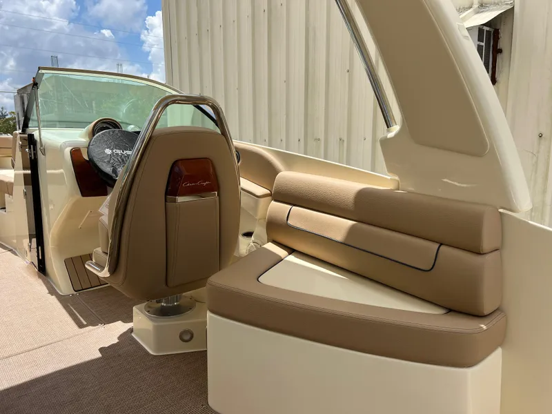 Slide: The Image of 2024 Chris-Craft Launch 25 GT interior with beige seating and captain's chair. - 8
