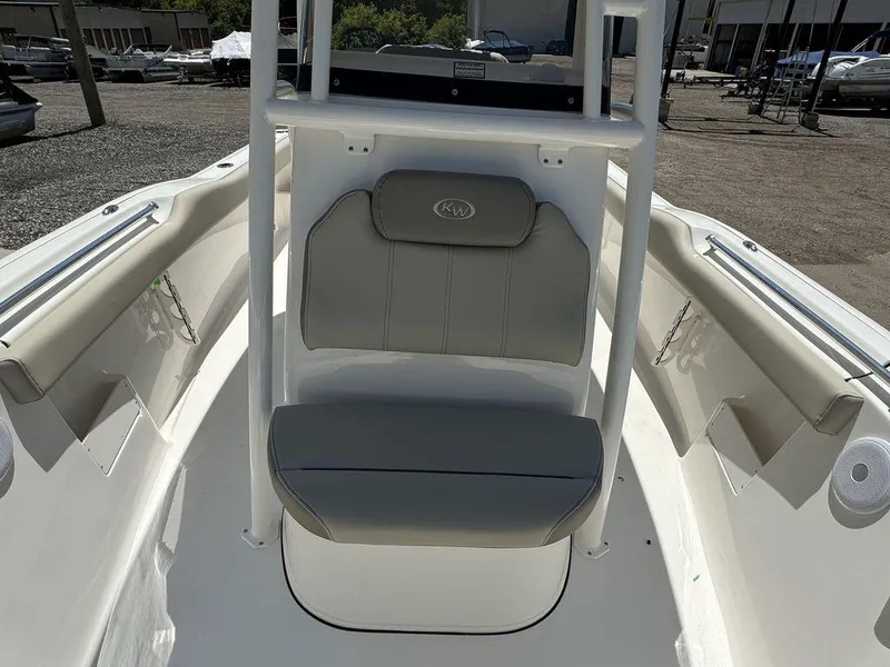 Slide: The Image of 2024 Key West 239 FS boat interior with cushioned seating and storage compartments. - 7