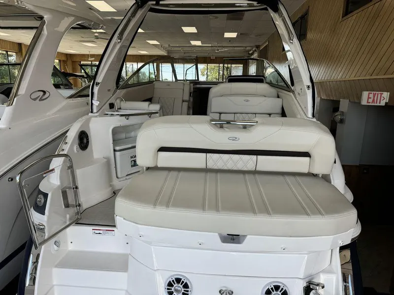 Slide: The Image of 2025 Regal 28X boat interior with luxurious white seating and modern design. - 1