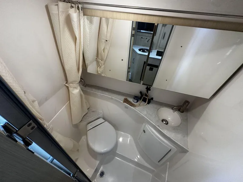 Slide: The Image of Compact bathroom in 2025 Regal 28X with shower, toilet, and sink. - 14