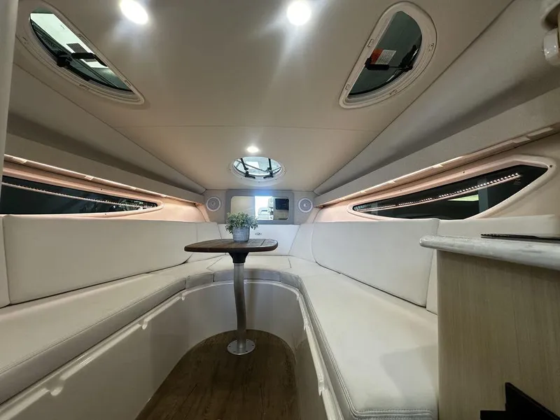 Slide: The Image of Luxurious interior of 2025 Regal 28X boat with elegant seating and table. - 3