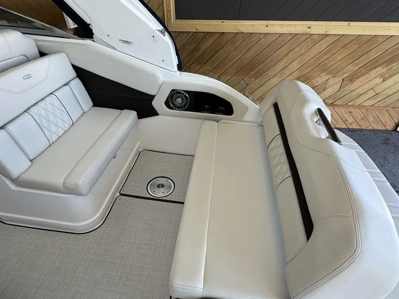Slide: The Image of Luxurious interior seating of 2025 Regal 28X boat with elegant white upholstery. - 9