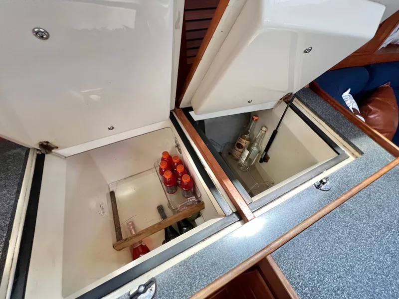 Slide: The Image of Built-in coolers on a 1999 Sabre 402 yacht with beverages inside. - 19