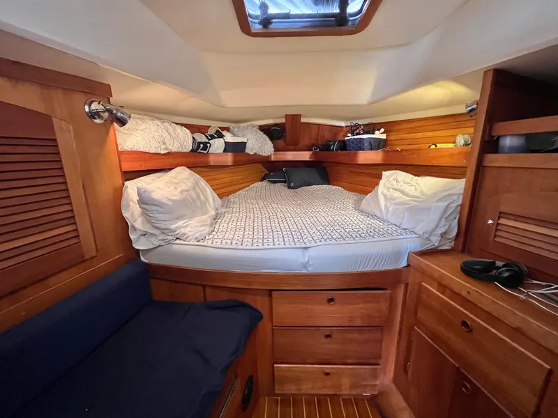 Slide: The Image of Cozy cabin interior of a 1999 Sabre 402 sailboat with wooden furnishings. - 3