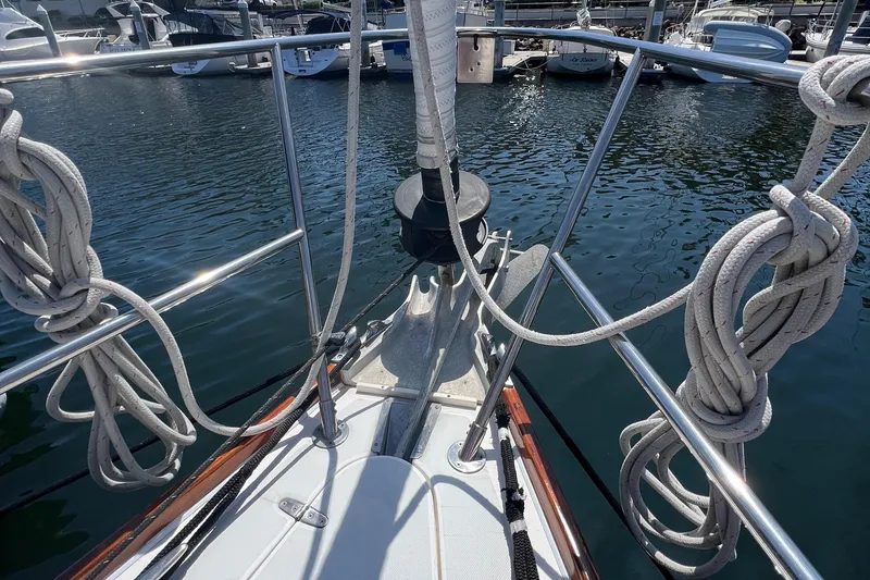 Slide: The Image of Bow of a 1999 Sabre 402 sailboat docked at a marina. - 36