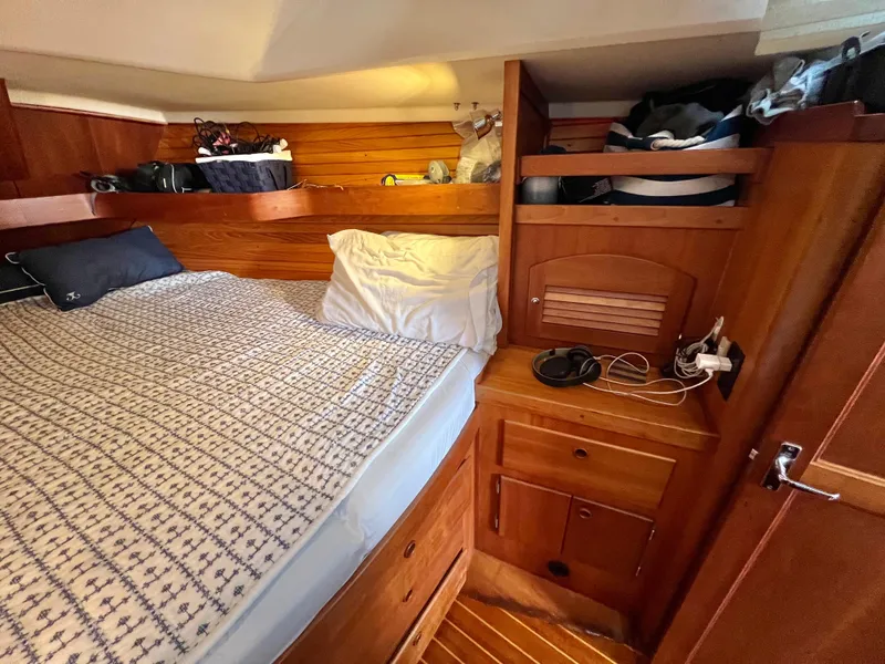 Slide: The Image of Cozy cabin interior of a 1999 Sabre 402 sailboat with wooden furnishings. - 4