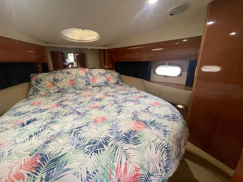 Slide: The Image of Luxurious bedroom in 2001 Viking Princess 45 Flybridge Sport Cruiser with tropical bedding. - 11