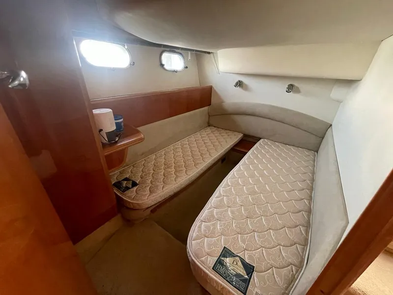 Slide: The Image of Interior cabin of 2001 Viking Princess 45 Flybridge Sport Cruiser with twin beds. - 13