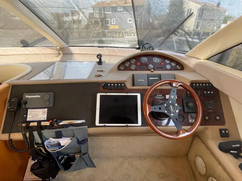 Slide: The Image of Helm of 2001 Viking Princess 45 Flybridge Sport Cruiser with steering wheel and navigation equipment. - 19