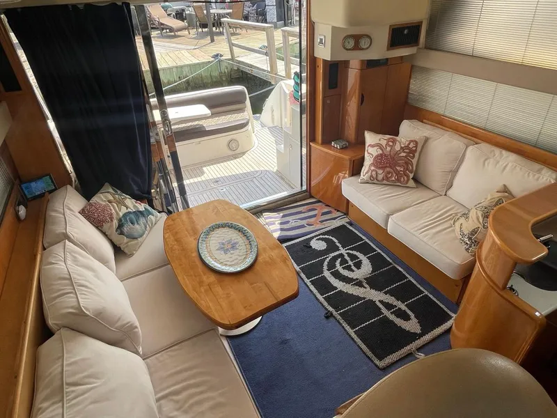 Slide: The Image of Interior of 2001 Viking Princess 45 Flybridge Sport Cruiser with cozy seating and elegant decor. - 20