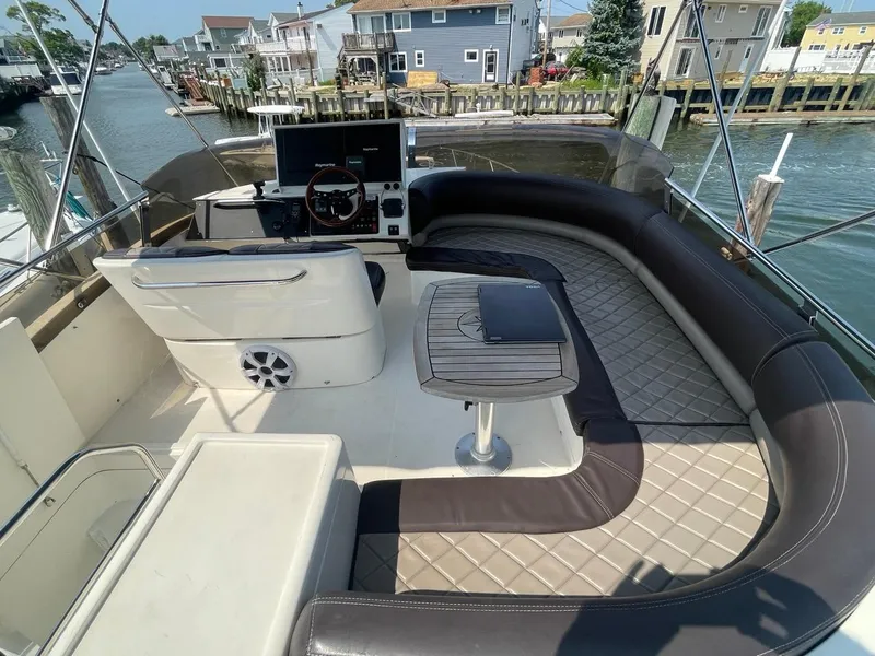 Slide: The Image of Flybridge of 2001 Viking Princess 45 Sport Cruiser with seating and helm station. - 29