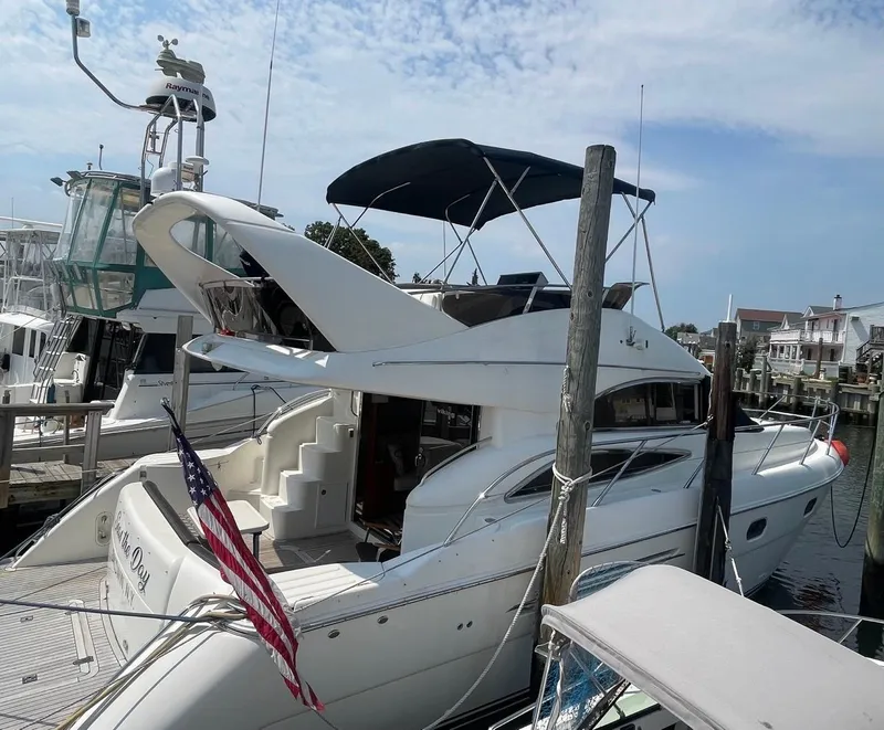 Slide: The Image of 2001 Viking Princess 45 Flybridge Sport Cruiser docked at marina. - 30