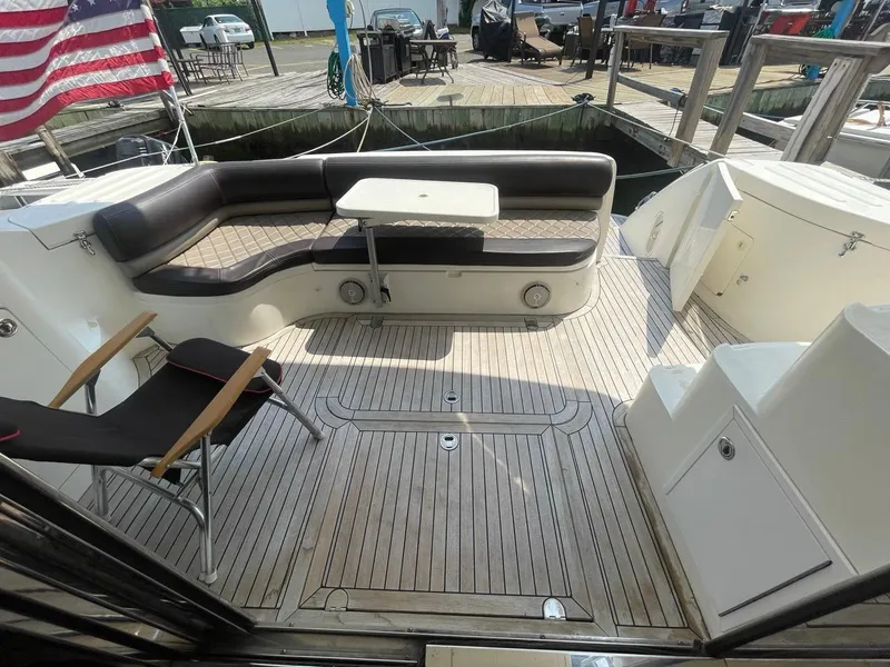 Slide: The Image of 2001 Viking Princess 45 Flybridge Sport Cruiser aft deck with seating and table. - 4