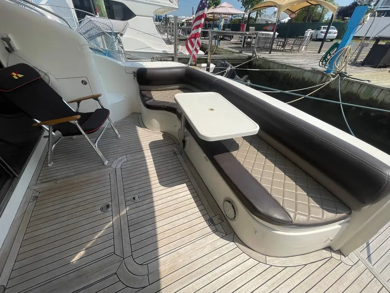 Slide: The Image of Outdoor seating area on a 2001 Viking Princess 45 Flybridge Sport Cruiser yacht. - 5