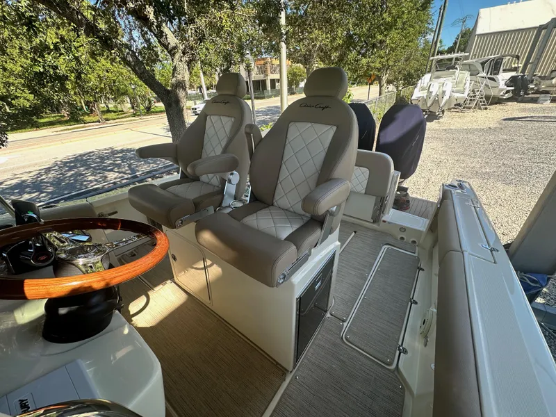 Slide: The Image of 2024 Chris-Craft Catalina 30 helm seats and steering wheel. - 12
