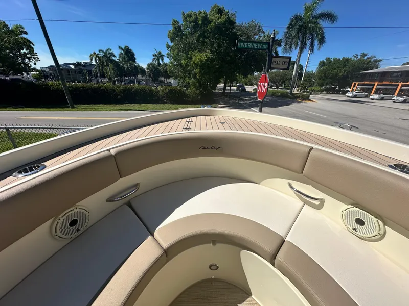 Slide: The Image of 2024 Chris-Craft Catalina 30 boat interior with beige seating and teak deck. - 14