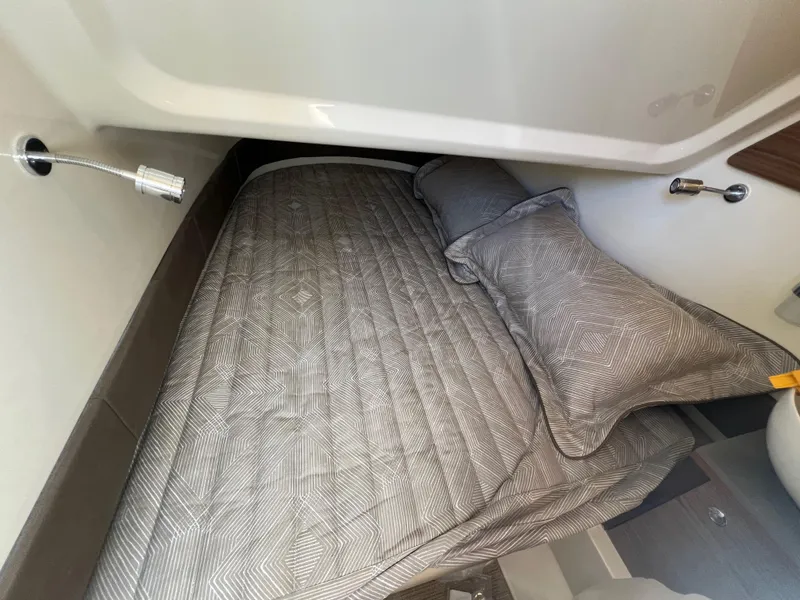 Slide: The Image of 2024 Chris-Craft Catalina 30 cabin bed with modern bedding. - 17