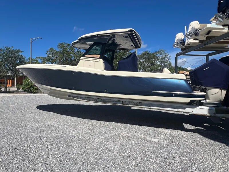 Slide: The Image of 2024 Chris-Craft Catalina 30 boat on a trailer under a clear blue sky. - 4