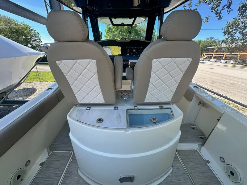 Slide: The Image of 2024 Chris-Craft Catalina 30 boat interior with dual seats and control panel. - 8
