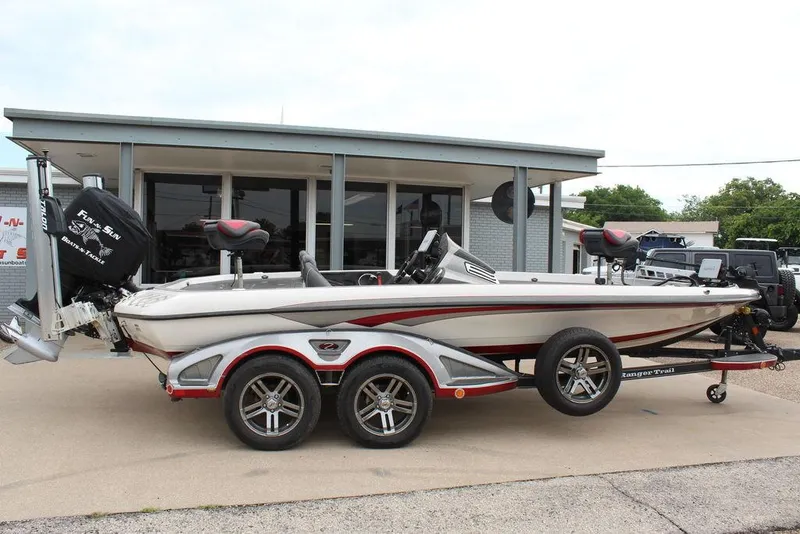 Slide: The Image of 2018 Ranger Z520C bass boat on a trailer outside a building. - 6