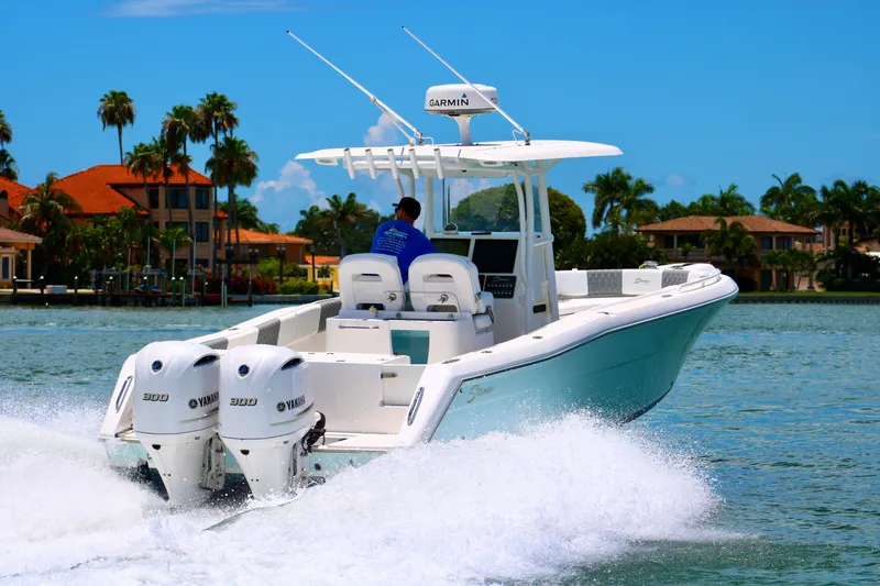 The Image of 2016 Stamas 317 Tarpon boat cruising on water with twin Yamaha engines. - 0