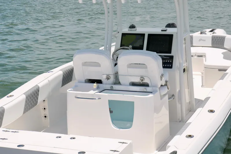 Slide: The Image of 2016 Stamas 317 Tarpon boat interior with dual seats and control panel. - 11