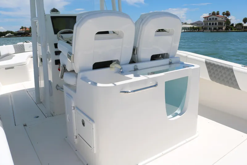 Slide: The Image of 2016 Stamas 317 Tarpon boat interior with dual seats and storage compartments. - 16