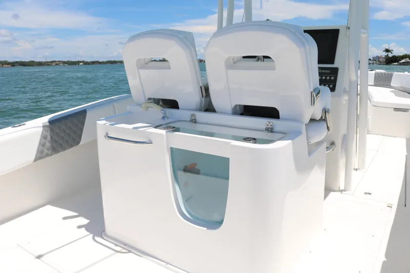Slide: The Image of 2016 Stamas 317 Tarpon boat interior with dual seats and storage compartment. - 17