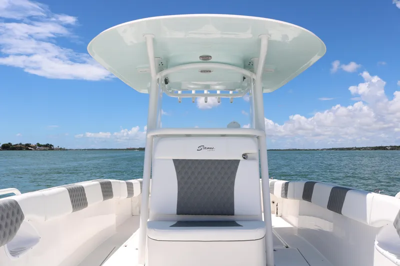 Slide: The Image of 2016 Stamas 317 Tarpon boat on water, clear sky background. - 27