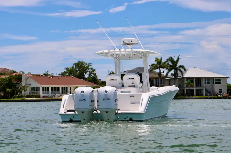 Slide: The Image of 2016 Stamas 317 Tarpon boat with twin engines on a sunny day. - 3