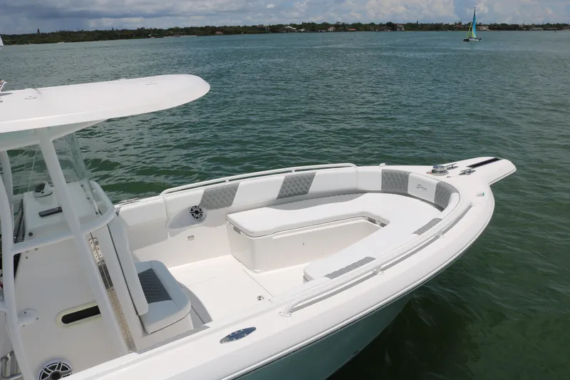 Slide: The Image of 2016 Stamas 317 Tarpon boat on calm water with spacious seating area. - 5