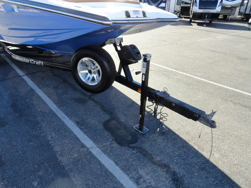 Slide: The Image of 2007 MasterCraft X-Star boat on trailer in parking lot. - 21