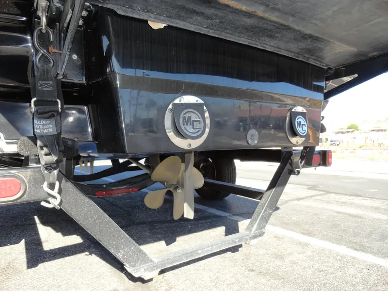 Slide: The Image of 2007 MasterCraft X-Star boat propeller and rear view on trailer. - 23
