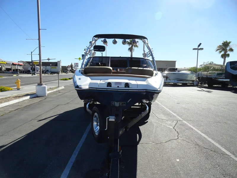 Slide: The Image of 2007 MasterCraft X-Star boat on trailer in parking lot. - 3